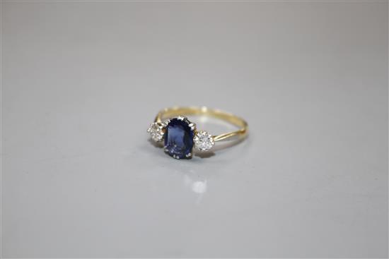 An 18ct and Plat, sapphire and diamond set three stone ring, size O/P, gross weight 2.3 grams.